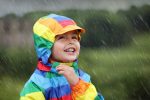 kid enjoying the rain